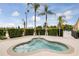 Relax in this community spa with palm trees nearby at 2856 Oakwater Dr # 2856, Kissimmee, FL 34747