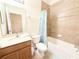 Clean bathroom with tub, shower, and wood vanity at 2856 Oakwater Dr # 2856, Kissimmee, FL 34747