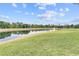 Serene pond with a water fountain feature at 2856 Oakwater Dr # 2856, Kissimmee, FL 34747