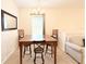 Dining area with a table, chairs, and a chandelier at 2856 Oakwater Dr # 2856, Kissimmee, FL 34747