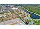 Aerial view showing community layout, pool, tennis court, and surrounding landscape at 2856 Oakwater Dr # 2856, Kissimmee, FL 34747