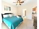 Bright bedroom with ensuite bathroom access and ceiling fan at 2856 Oakwater Dr # 2856, Kissimmee, FL 34747