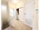 Upstairs hallway with laundry closet and bathroom access at 2856 Oakwater Dr # 2856, Kissimmee, FL 34747