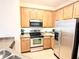 Modern kitchen with stainless steel appliances and ample cabinetry at 2856 Oakwater Dr # 2856, Kissimmee, FL 34747
