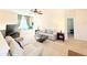 Open living area with two sofas, a TV, and a window seat at 2856 Oakwater Dr # 2856, Kissimmee, FL 34747