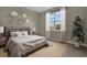 Bright bedroom with large window and neutral decor at 3577 Dahlia Dr, Lake Hamilton, FL 33851