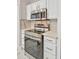Modern kitchen with stainless steel appliances and white cabinets at 3618 Wellington Ln, Bartow, FL 33830