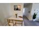 Small dining area with marble top table and gold chairs at 4400 Thornbriar Ln # 201, Orlando, FL 32822