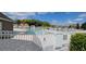 Community pool area with fence and gate at 4400 Thornbriar Ln # 201, Orlando, FL 32822