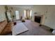 Living room with fireplace, plush seating and a large area rug at 4400 Thornbriar Ln # 201, Orlando, FL 32822