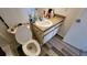 Bathroom with toilet, sink, and vanity at 4400 Thornbriar Ln # 201, Orlando, FL 32822
