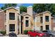 Tan apartment building with balconies and ample parking at 4400 Thornbriar Ln # 201, Orlando, FL 32822
