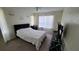 Bright bedroom with double bed, window, and TV at 4400 Thornbriar Ln # 201, Orlando, FL 32822