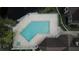 L-shaped pool with surrounding deck and adjacent building at 4400 Thornbriar Ln # 201, Orlando, FL 32822