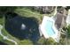 Aerial view showing community pool and pond with fountain at 4400 Thornbriar Ln # 201, Orlando, FL 32822