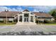 Community building with brick facade and parking at 4400 Thornbriar Ln # 201, Orlando, FL 32822