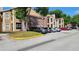Exterior view of condo building and parking lot at 4400 Thornbriar Ln # 201, Orlando, FL 32822