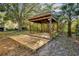 Wooden gazebo with attached deck in backyard at 5105 Forestgreen W Dr, Lakeland, FL 33811