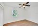 Well-lit bedroom with wood-look floors and window at 5105 Forestgreen W Dr, Lakeland, FL 33811