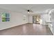 Spacious living area with hardwood floors and sliding glass doors at 5105 Forestgreen W Dr, Lakeland, FL 33811