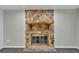 Stone fireplace adds warmth and character to the living space at 5105 Forestgreen W Dr, Lakeland, FL 33811