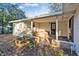 Covered patio with hot tub and brick border at 5105 Forestgreen W Dr, Lakeland, FL 33811