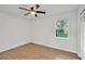 Spacious bedroom featuring wood-look floors and a window at 5105 Forestgreen W Dr, Lakeland, FL 33811