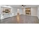 Bright living room features a stone fireplace and hardwood floors at 5105 Forestgreen W Dr, Lakeland, FL 33811