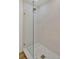 Modern shower with glass enclosure and patterned tile floor at 5105 Forestgreen W Dr, Lakeland, FL 33811