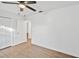Bright bedroom with wood-look floors and ceiling fan at 5105 Forestgreen W Dr, Lakeland, FL 33811
