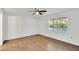 Bright bedroom with hardwood floors and large window at 5105 Forestgreen W Dr, Lakeland, FL 33811