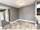 Simple dining area with tile floors and gray walls at 6142 Westgate Dr # 104, Orlando, FL 32835