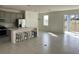 Open concept kitchen with gray cabinets, island, and tile flooring at 6817 Serpent Hawk Lane St, Howey In The Hills, FL 34737