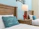 Twin bedroom with coastal decor and nightstand at 8020 Shaker St, Kissimmee, FL 34747