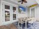 Outdoor patio with dining table and chairs, close to the pool at 8020 Shaker St, Kissimmee, FL 34747