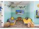 Fun game room with seating, TV, and arcade games at 8020 Shaker St, Kissimmee, FL 34747