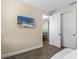 Bedroom with a view of the kitchen and access to the hallway at 8020 Shaker St, Kissimmee, FL 34747