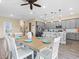 Modern kitchen with gray cabinets, white tile backsplash, and an island at 8020 Shaker St, Kissimmee, FL 34747