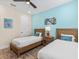 Bedroom with twin beds and coastal decor at 8020 Shaker St, Kissimmee, FL 34747