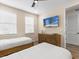 Bedroom with twin beds and dresser with TV at 8020 Shaker St, Kissimmee, FL 34747