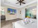 Main bedroom with large TV and access to other rooms at 8020 Shaker St, Kissimmee, FL 34747