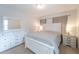 Spacious bedroom with a white queen-size bed and neutral decor at 9036 Arbors Edge Trl, Windermere, FL 34786