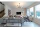 Spacious living area with large windows, comfortable seating, and modern decor at 9036 Arbors Edge Trl, Windermere, FL 34786