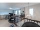 Upstairs loft area with a desk and seating, ideal for an office or study at 9036 Arbors Edge Trl, Windermere, FL 34786