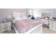 Main bedroom with a stylish queen bed and a vanity area at 9036 Arbors Edge Trl, Windermere, FL 34786