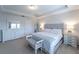 Main bedroom with king bed, dresser, and lots of natural light at 9036 Arbors Edge Trl, Windermere, FL 34786