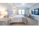 King-size bed in a well-lit main bedroom with ample space at 9036 Arbors Edge Trl, Windermere, FL 34786