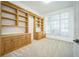 Home office featuring built-in wooden shelving and cabinets at 1229 Vista Hills Dr, Lakeland, FL 33813