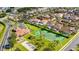 An aerial view of the community with tennis courts and a playground at 148 Brunello Dr, Davenport, FL 33897