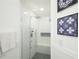 Spacious walk-in shower with white subway tile, built-in bench, and rainfall showerhead at 148 Brunello Dr, Davenport, FL 33897